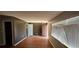 Open living area with window and wood-look flooring at 1507 N Lake Dr, Sun City Center, FL 33573