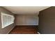 Living room featuring hard surface floors and a large window at 1507 N Lake Dr, Sun City Center, FL 33573