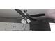 Living room features a modern ceiling fan with lights and neutral-colored walls at 1507 N Lake Dr, Sun City Center, FL 33573