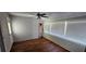 Sunroom features lots of natural light and hardwood flooring at 1507 N Lake Dr, Sun City Center, FL 33573