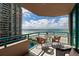 Spacious condo balcony offers seating and panoramic views of the ocean and beachfront at 1520 Gulf Blvd # 805, Clearwater Beach, FL 33767