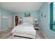 Bright bedroom features calming blue walls, coastal decor, and white wood accents at 1520 Gulf Blvd # 805, Clearwater Beach, FL 33767