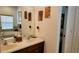 Bathroom featuring double sinks, a soaking tub, and modern fixtures at 1648 Mira Lago Cir, Ruskin, FL 33570