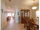 Traditional dining room with wood table, chairs, and a display cabinet at 1648 Mira Lago Cir, Ruskin, FL 33570