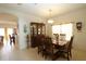 Inviting dining area featuring a wooden table and chairs under a chandelier at 1648 Mira Lago Cir, Ruskin, FL 33570