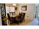 The dining area features a wood table and chairs set, bathed in natural light at 1648 Mira Lago Cir, Ruskin, FL 33570