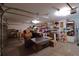 Spacious garage with ample storage shelving and workspace for various projects at 1648 Mira Lago Cir, Ruskin, FL 33570