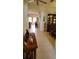 Inviting hallway with tile flooring that leads to the living area and dining room at 1648 Mira Lago Cir, Ruskin, FL 33570