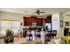 Kitchen featuring a breakfast bar with barstools, seating in background, and modern appliances at 1648 Mira Lago Cir, Ruskin, FL 33570