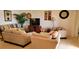 Inviting living room featuring cozy seating, plants, and decorative wall art at 1648 Mira Lago Cir, Ruskin, FL 33570