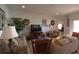 Comfortable living room featuring neutral walls, plush couches and bright natural lighting at 1648 Mira Lago Cir, Ruskin, FL 33570