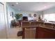 Open floor plan: living room with cozy furniture and views into dining area at 1648 Mira Lago Cir, Ruskin, FL 33570