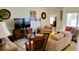 Comfortable living room showcasing stylish furniture and views into another room at 1648 Mira Lago Cir, Ruskin, FL 33570