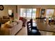 Relaxing living room with water view, access to the lanai, and seating at 1648 Mira Lago Cir, Ruskin, FL 33570