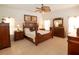 The main bedroom features a wood bed set, neutral walls, and tile flooring at 1648 Mira Lago Cir, Ruskin, FL 33570