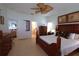 The main bedroom features a wood bed set, neutral walls, and tile flooring at 1648 Mira Lago Cir, Ruskin, FL 33570