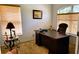 Cozy office space featuring a large desk, comfortable chair and plenty of natural light at 1648 Mira Lago Cir, Ruskin, FL 33570