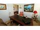 Comfortable office space featuring a large desk, comfortable chair and stylish decor at 1648 Mira Lago Cir, Ruskin, FL 33570