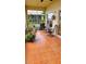 Relaxing screened-in patio with tile flooring and comfortable seating, perfect for enjoying the outdoors at 1648 Mira Lago Cir, Ruskin, FL 33570