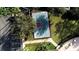 Aerial view of the community tennis court with surrounding landscaping at 1648 Mira Lago Cir, Ruskin, FL 33570