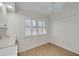 Bright breakfast nook features a ceiling fan, wood floors, a window with white shutters, and a light colored countertop at 1685 Fry Ct, Dunedin, FL 34698