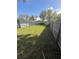 A lovely fenced backyard featuring a screened-in pool, perfect for outdoor enjoyment and privacy at 1982 Seton Dr, Clearwater, FL 33763