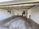 Spacious garage interior with utility sink, ideal for parking, storage, and various projects at 1982 Seton Dr, Clearwater, FL 33763