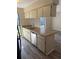 Kitchen with ample counter space, wood-look floors, and views to the living area at 1982 Seton Dr, Clearwater, FL 33763