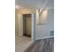 Cozy living room featuring wood-look floors, closet with louvered doors, and display niche at 1982 Seton Dr, Clearwater, FL 33763