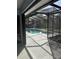 Screened in pool area featuring a swimming pool and a concrete patio deck at 1982 Seton Dr, Clearwater, FL 33763