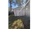 Backyard view of the shed with double doors on a grass-filled lot at 1982 Seton Dr, Clearwater, FL 33763