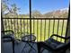 Relaxing balcony view with seating, overlooking lush green golf course and blue skies at 2210 Gulf View Blvd # 22, Dunedin, FL 34698