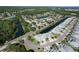 Aerial view of a neighborhood featuring ponds and well-maintained homes and landscaping at 284 Hemingway Dr, Oldsmar, FL 34677