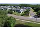 Aerial shot of a neighborhood with townhomes that feature light-colored exteriors and well-manicured landscaping at 284 Hemingway Dr, Oldsmar, FL 34677