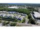 Aerial view of a peaceful residential community with waterfront properties, mature trees, and a serene atmosphere at 284 Hemingway Dr, Oldsmar, FL 34677