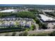 Aerial view of charming neighborhood featuring waterways, green spaces, and convenient access to shopping and amenities at 284 Hemingway Dr, Oldsmar, FL 34677