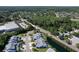 Wide aerial shot showing well-planned neighborhood, landscaping, and nearby roads at 284 Hemingway Dr, Oldsmar, FL 34677