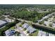 A neatly landscaped community nestled amongst Florida greenery including ponds and canals at 284 Hemingway Dr, Oldsmar, FL 34677