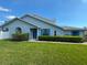 Beautiful single-Gathering home with blue shutters and a well-manicured lawn at 284 Hemingway Dr, Oldsmar, FL 34677