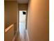 Upstairs hallway featuring updated flooring and access to the bedrooms at 284 Hemingway Dr, Oldsmar, FL 34677