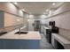 Modern kitchen boasting stainless steel appliances, quartz countertops, and ample cabinet space at 284 Hemingway Dr, Oldsmar, FL 34677
