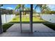 Screened-in lanai featuring a view of the backyard and surrounding landscape at 284 Hemingway Dr, Oldsmar, FL 34677