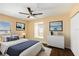 Stylish bedroom featuring neutral decor, dark floors, and comfortable furnishings at 4405 Tuscan Loon Dr, Tampa, FL 33619