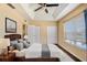 Comfortable bedroom featuring a ceiling fan, modern decor, and natural light from the window at 4405 Tuscan Loon Dr, Tampa, FL 33619