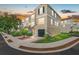 Charming multi-story townhome with a well-manicured lawn, landscaping, and inviting curb appeal at 4405 Tuscan Loon Dr, Tampa, FL 33619