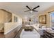 Bright and airy living room featuring hardwood floors, comfortable seating, and abundant natural light at 4405 Tuscan Loon Dr, Tampa, FL 33619