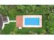 Aerial view of a rectangular swimming pool with lounge chairs, surrounded by green grass and tropical foliage at 4405 Tuscan Loon Dr, Tampa, FL 33619