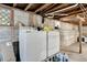 Utility basement featuring the laundry appliances and a small window for some natural light at 4716 Gazania St, New Port Richey, FL 34652