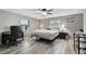 Cozy bedroom with wood floors, gray walls, decorated with inspiring wall decals, and an office space at 4716 Gazania St, New Port Richey, FL 34652