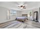 Spacious bedroom with ample natural light, ceiling fan, and neutral décor at 4716 Gazania St, New Port Richey, FL 34652